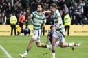 Nicolas Kuhn and James Forrest celebrate in Dingwall against Ross County