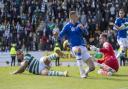 Giorgos Giakoumakis bundles home deep into stoppage time to give Celtic a crucial win at St Johnstone.