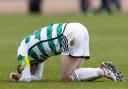 Celtic's Callum McGregor goes down injured during a cinch Premiership match against Dundee