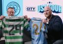 Paul Dickov and John Hartson exchange shirts