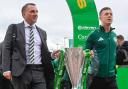 Celtic manager Brendan Rodgers and Callum McGregor carry the William Hill Premiership trophy