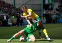 Hibernian's Rudi Molotnikov (left) and Celtic's Alistair Johnston battle for the ball during the William Hill Premiership match at Easter Road Stadium, Edinburgh. Picture date: Sunday August 11, 2024. PA Photo. See PA story SOCCER Hibernian. Photo credit