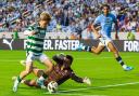 Kyogo in action against Man City during pre-season