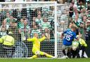 GLASGOW, SCOTLAND - SEPTEMBER 01: Celtic's Kasper Schmeichel saves a shot from Rangers' Ross McCausland during a William Hill Premiership match between Celtic and Rangers at Celtic Park, on September 01, 2024, in Glasgow, Scotland. (Photo by Craig