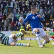 Giorgos Giakoumakis bundles home deep into stoppage time to give Celtic a crucial win at St Johnstone.