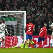 Antoine Griezmann scores past Celtic goalkeeper Joe Hart (grounded)