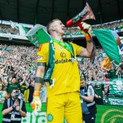 Joe Hart stands in front of The Green Brigade