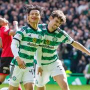 GLASGOW, SCOTLAND - APRIL 13: Celtic's Reo Hatate celebrates with Matt O'Riley after scoring to make it 1-0 during a cinch Premiership match between Celtic and St Mirren at Celtic Park, on April 13, 2024, in Glasgow, Scotland. (Photo by Craig Williamson