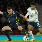 Shea Charles and John McGinn fight for possession