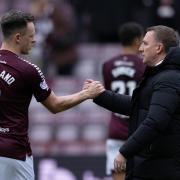 EDINBURGH, SCOTLAND - MARCH 03: Celtic Manager Brendan Rodgers shakes hands with Hearts' Lawrence Shankland at full time during a cinch Premiership match between Heart of Midlothian and Celtic at Tynecastle Park, on March 03, 2024, in Edinburgh,