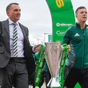 Celtic manager Brendan Rodgers and Callum McGregor carry the William Hill Premiership trophy