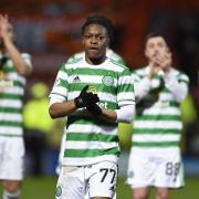 Karamoko Dembele celebrates with his Celtic teammates after a Scottish Cup match