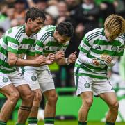 Kyogo and O'Riley celebrate with Nicolas Kuhn at Celtic Park