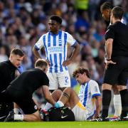 Matt O'Riley receives treatment following the tackle