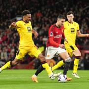 Sheffield United's Auston Trusty challenges Manchester United's Diogo Dalot during a Premier League match at Old Trafford