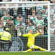 GLASGOW, SCOTLAND - SEPTEMBER 01: Celtic's Kasper Schmeichel saves a shot from Rangers' Ross McCausland during a William Hill Premiership match between Celtic and Rangers at Celtic Park, on September 01, 2024, in Glasgow, Scotland. (Photo by Craig