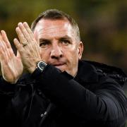 Brendan Rodgers applauds the travelling Celtic support in Germany