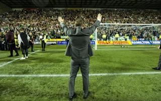 Brendan Rodgers applauds the Celtic support after clinching the Scottish Premiership title