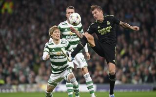 Kyogo and Toni Kroos vie for possession at Celtic Park