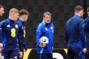 Scotland assistant manager John Carver says that memories of what the national side achieved in Serbia four years ago can drive them towards World Cup qualification.