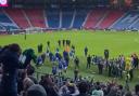 Rangers players trudge off the field at Hampden