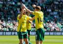 Celtic's Nicolas Kuhn (left) celebrates with James Forrest after scoring the first goal of the game during the William Hill Premiership match at Easter Road Stadium, Edinburgh. Picture date: Sunday August 11, 2024. PA Photo. See PA story SOCCER