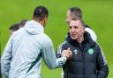 GLASGOW, SCOTLAND - MAY 23: Celtic Manager Brendan Rodgers shakes hands with Adam Idah during a Celtic training session at Lennoxtown Training Centre, on May 23, 2024, in Glasgow, Scotland. (Photo by Craig Williamson / SNS Group)