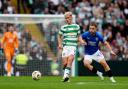 Celtic's Luke McCowan (left) and Rangers' Nicolas Raskin battle for the ball