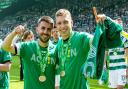 Celtic's Greg Taylor and Alistair Johnston celebrate winning the 2023/24 Scottish Premiership