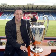 29/04/02 Celtic ace Paul Lambert revives memories of his triumph with Borussia Dortmund by laying his hands on the Champions League trophy again.