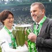 Kyogo and Ange Postecoglou hold the Premiership trophy