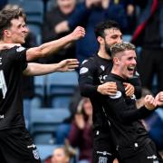 Luke McCowan celebrates scoring for Dundee