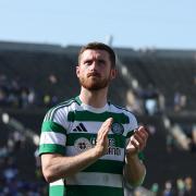 Anthony Ralston applauds the crowd