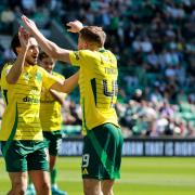 Celtic's Nicolas Kuhn (left) celebrates with James Forrest after scoring the first goal of the game during the William Hill Premiership match at Easter Road Stadium, Edinburgh. Picture date: Sunday August 11, 2024. PA Photo. See PA story SOCCER