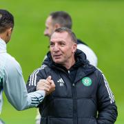 GLASGOW, SCOTLAND - MAY 23: Celtic Manager Brendan Rodgers shakes hands with Adam Idah during a Celtic training session at Lennoxtown Training Centre, on May 23, 2024, in Glasgow, Scotland. (Photo by Craig Williamson / SNS Group)