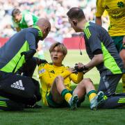 Celtic's Kyogo Furuhashi gets treatment for an injury