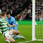 Alistair Johnston looks on at his goal against Dundee at Celtic Park