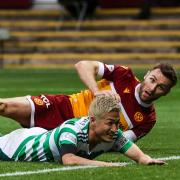 Motherwell's Stephen O'Donnell and Celtic's Daizen Maeda collide