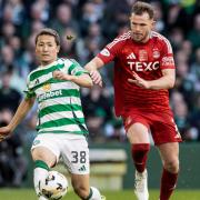 Daizen Maeda and Nicky Devlin fight for possession at Celtic Park