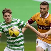 James Forrest and Stephen O'Donnell fight for possession at Celtic Park