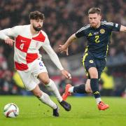 Croatia's Josko Gvardiol and Scotland's Anthony Ralston battle for the ball during the UEFA Nations League Group A1 match at Hampden Park, Glasgow